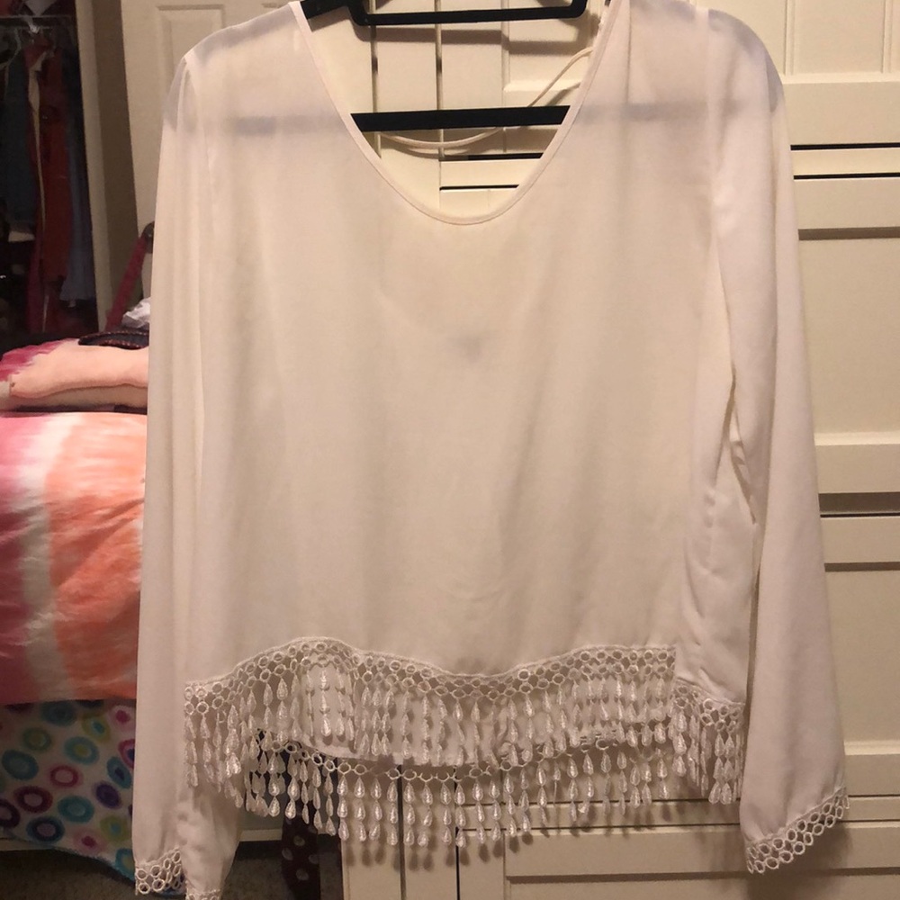 White blouse with tassels